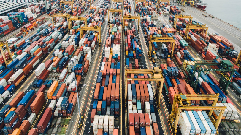 A bustling shipping port representing the dynamic nature of global logistics.